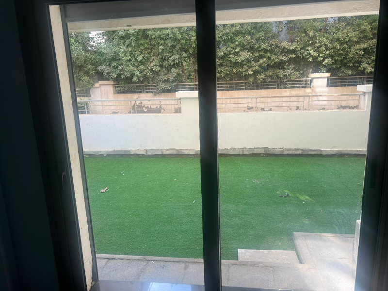Semi furnished apartment with garden for rent in Taj sultan